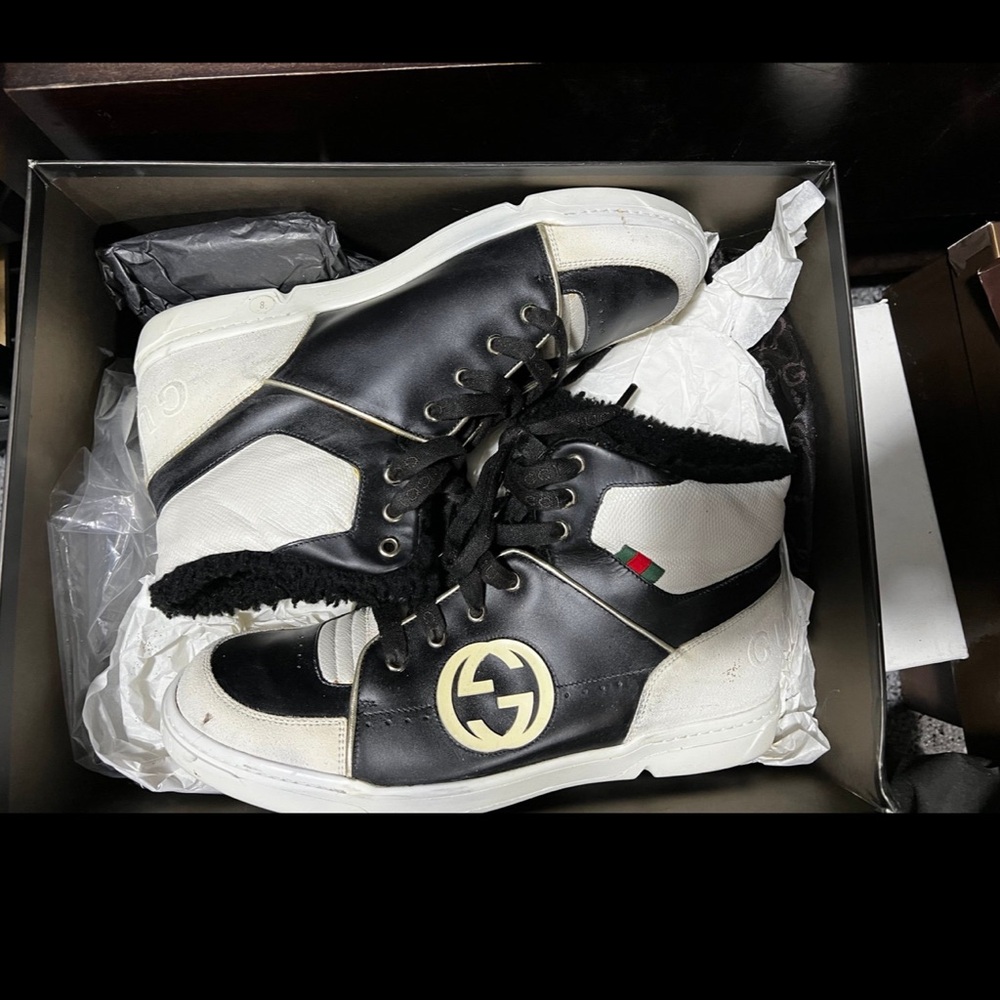 Gucci high top sneakers.